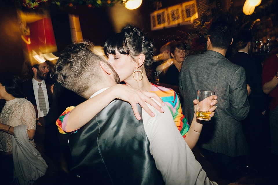 Megan wears a colourful rainbow Valentino gown for her cool and quirky London pub wedding. Photography by Lee Garland.