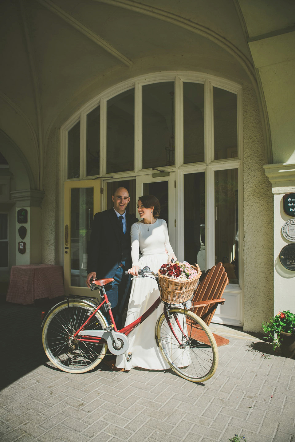 A long sleeved 1950's inspired wedding dress handmade by the bride herself. Photography by Paula Gillespie.