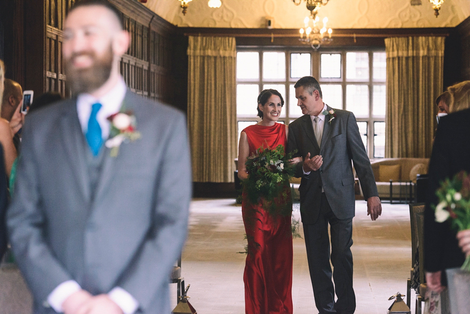 Nicola wears a red silk Amanda Wakeley dress for her glamorous Autumn wedding. Photography by Chiron Cole.