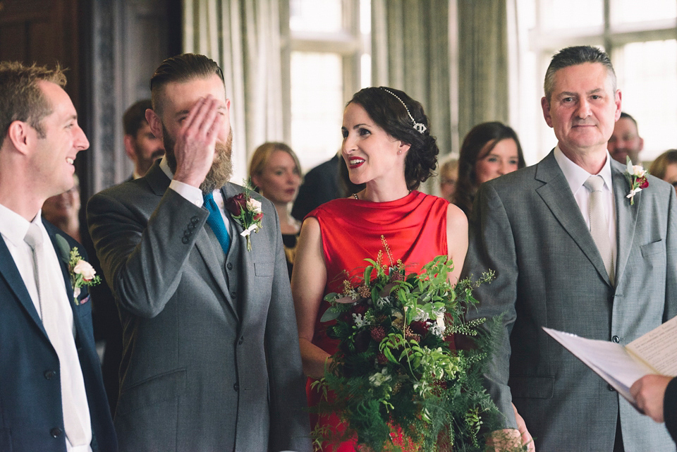 Nicola wears a red silk Amanda Wakeley dress for her glamorous Autumn wedding. Photography by Chiron Cole.