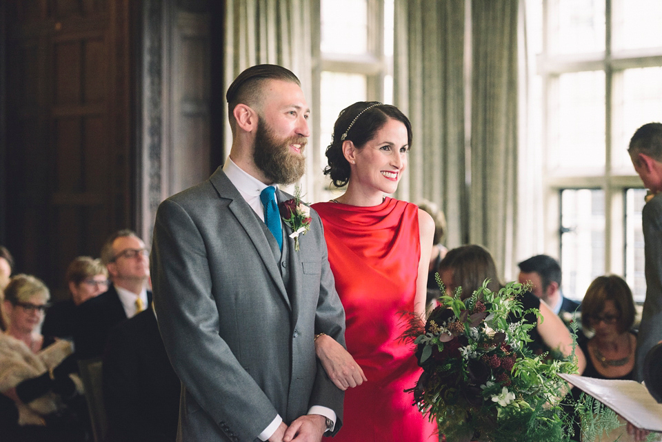 Nicola wears a red silk Amanda Wakeley dress for her glamorous Autumn wedding. Photography by Chiron Cole.