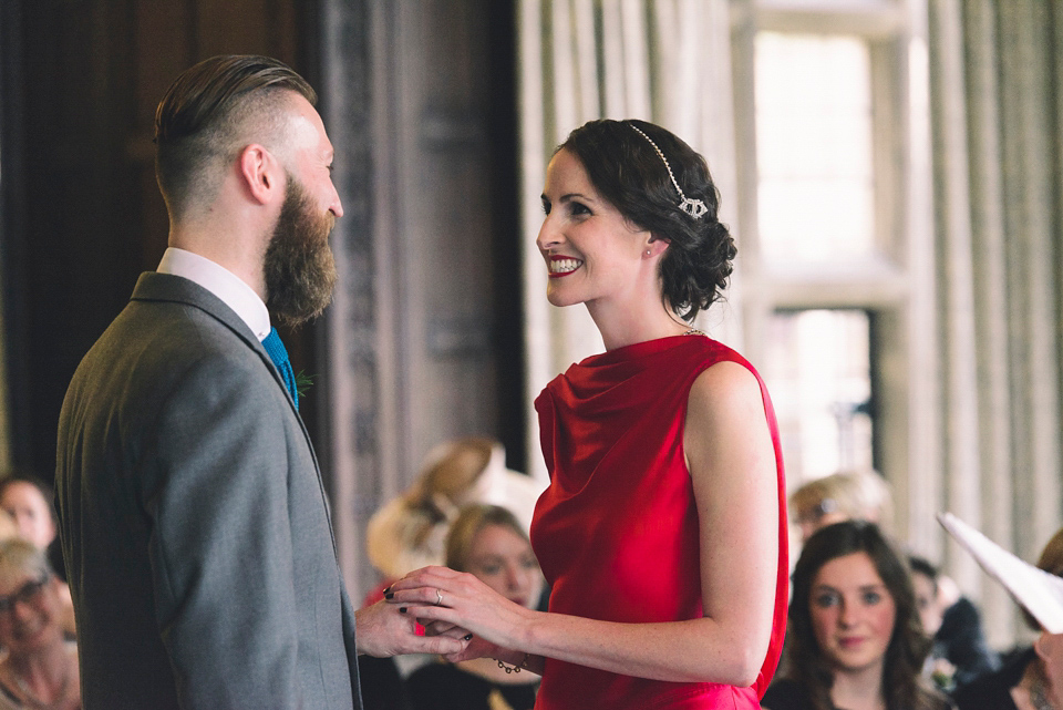 Nicola wears a red silk Amanda Wakeley dress for her glamorous Autumn wedding. Photography by Chiron Cole.