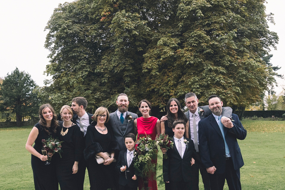 Nicola wears a red silk Amanda Wakeley dress for her glamorous Autumn wedding. Photography by Chiron Cole.