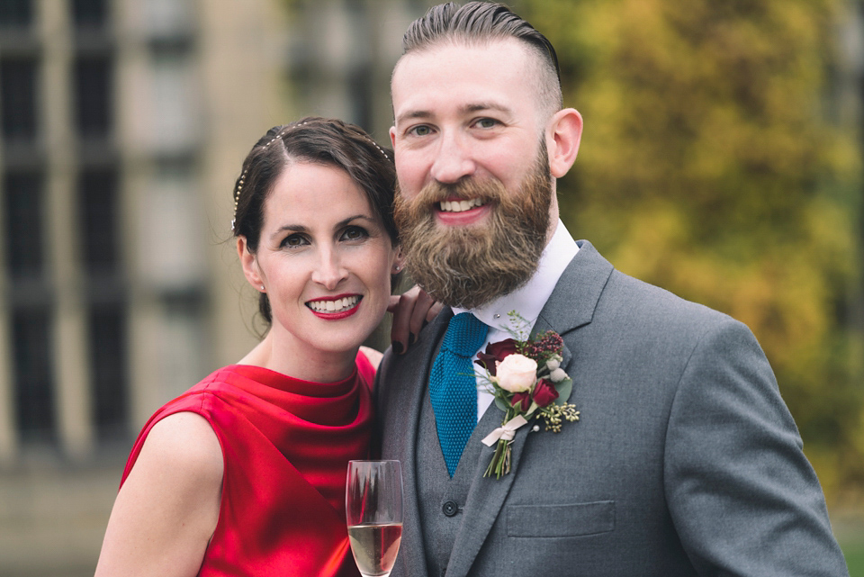 Nicola wears a red silk Amanda Wakeley dress for her glamorous Autumn wedding. Photography by Chiron Cole.