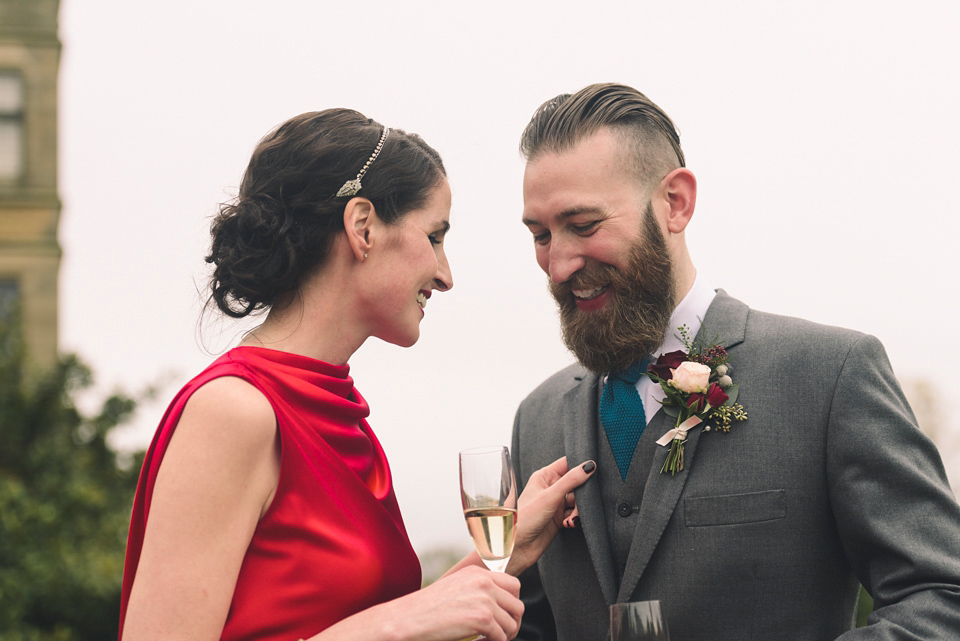 Nicola wears a red silk Amanda Wakeley dress for her glamorous Autumn wedding. Photography by Chiron Cole.