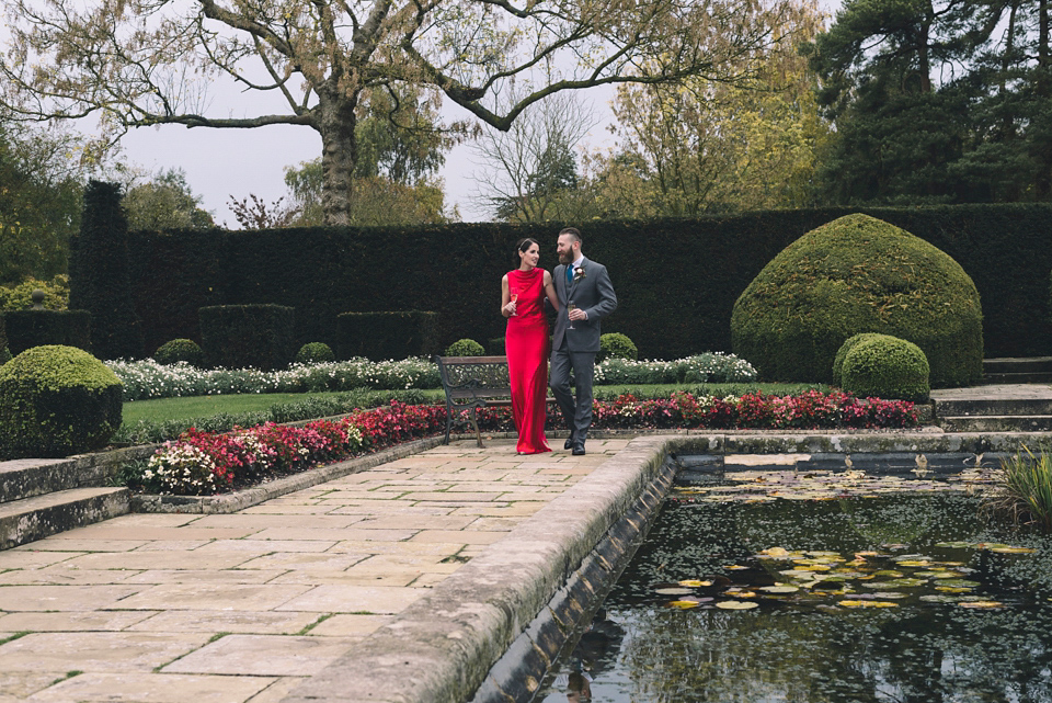 Nicola wears a red silk Amanda Wakeley dress for her glamorous Autumn wedding. Photography by Chiron Cole.