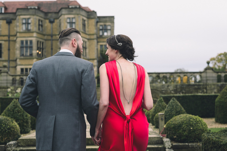 Nicola wears a red silk Amanda Wakeley dress for her glamorous Autumn wedding. Photography by Chiron Cole.