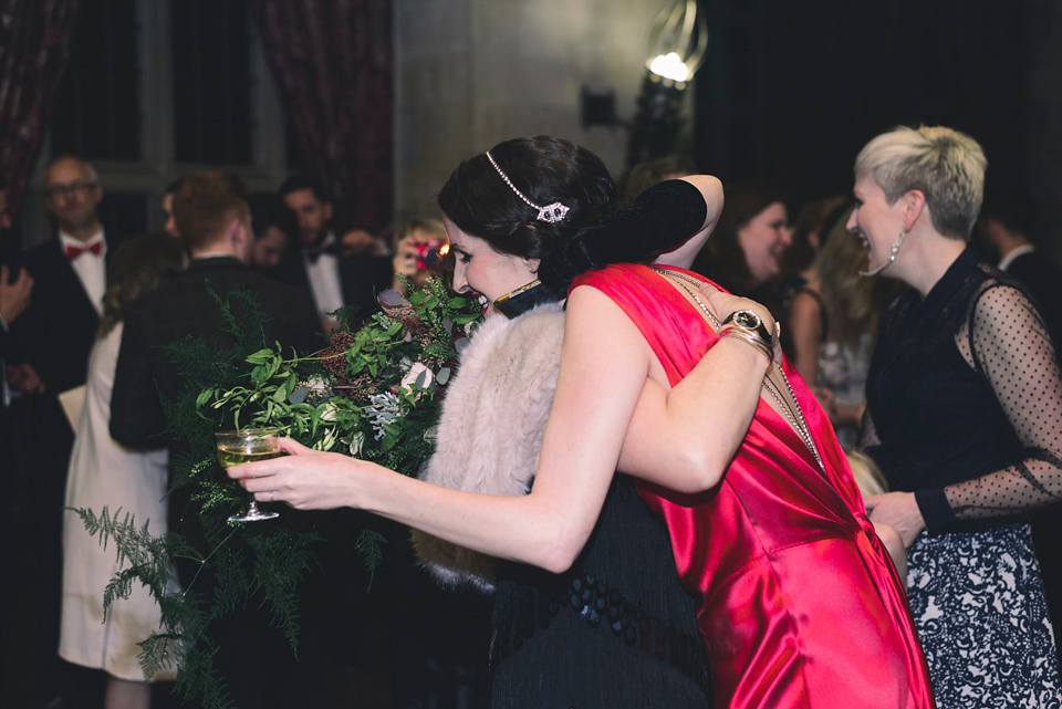 Nicola wears a red silk Amanda Wakeley dress for her glamorous Autumn wedding. Photography by Chiron Cole.