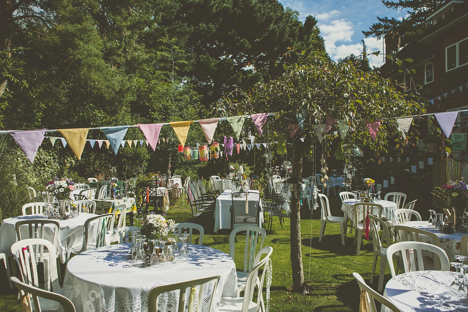 Kat wore an Oxfam wedding dress for her laid back and homemade wedding in her Mum's back garden. Photography by India Hobson.