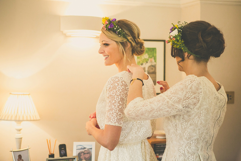 Kat wore an Oxfam wedding dress for her laid back and homemade wedding in her Mum's back garden. Photography by India Hobson.