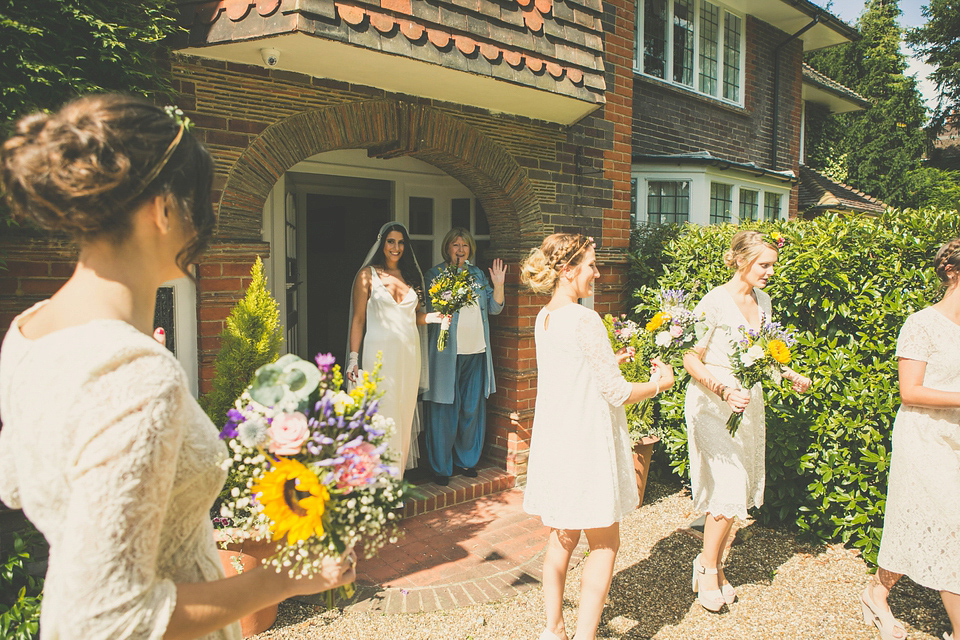 Kat wore an Oxfam wedding dress for her laid back and homemade wedding in her Mum's back garden. Photography by India Hobson.