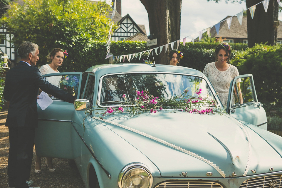 Kat wore an Oxfam wedding dress for her laid back and homemade wedding in her Mum's back garden. Photography by India Hobson.