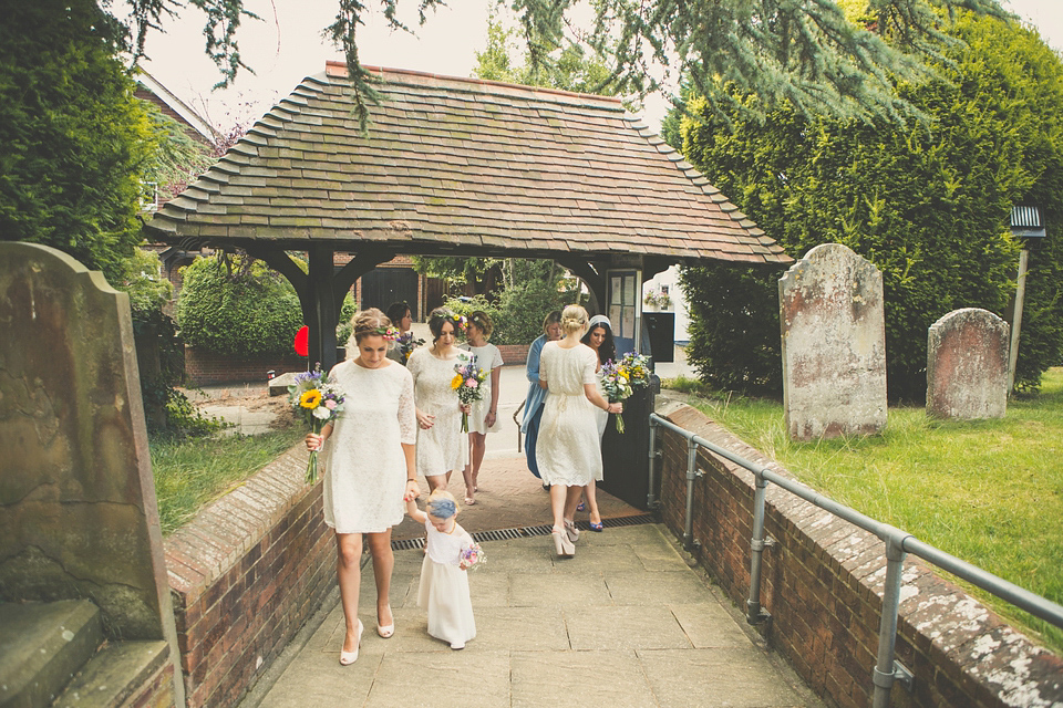 Kat wore an Oxfam wedding dress for her laid back and homemade wedding in her Mum's back garden. Photography by India Hobson.