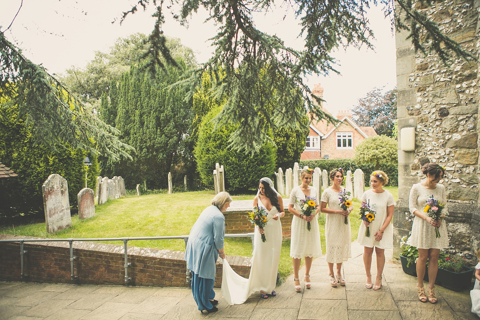 Kat wore an Oxfam wedding dress for her laid back and homemade wedding in her Mum's back garden. Photography by India Hobson.