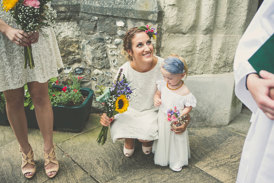 Kat wore an Oxfam wedding dress for her laid back and homemade wedding in her Mum's back garden. Photography by India Hobson.