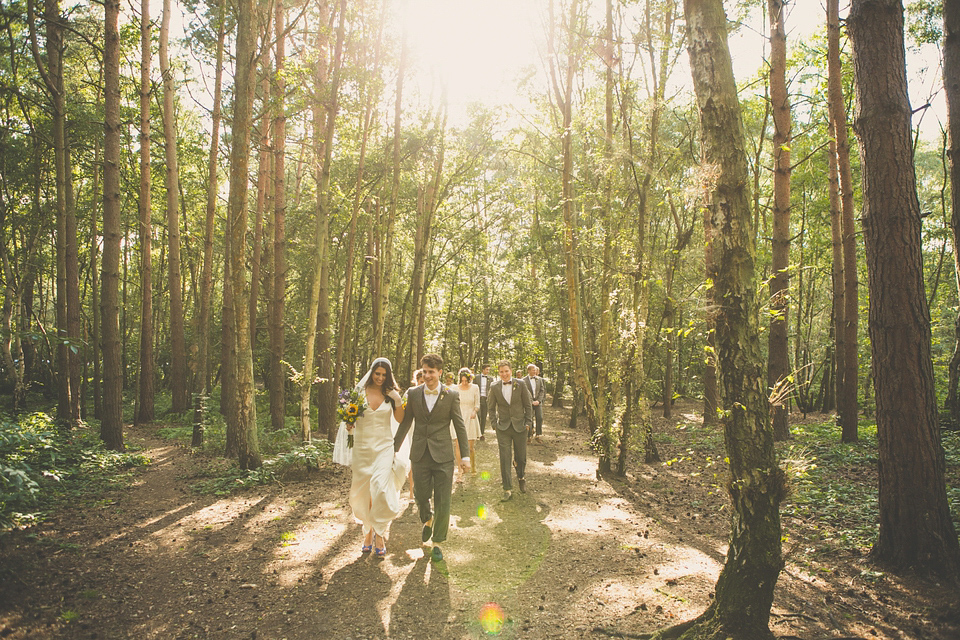 Kat wore an Oxfam wedding dress for her laid back and homemade wedding in her Mum's back garden. Photography by India Hobson.