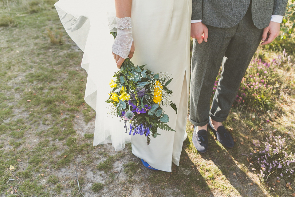 Kat wore an Oxfam wedding dress for her laid back and homemade wedding in her Mum's back garden. Photography by India Hobson.