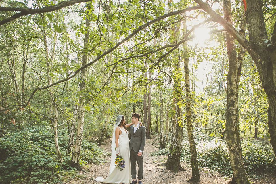 Kat wore an Oxfam wedding dress for her laid back and homemade wedding in her Mum's back garden. Photography by India Hobson.