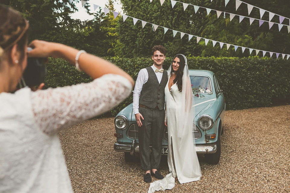 Kat wore an Oxfam wedding dress for her laid back and homemade wedding in her Mum's back garden. Photography by India Hobson.