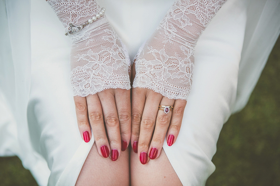 Kat wore an Oxfam wedding dress for her laid back and homemade wedding in her Mum's back garden. Photography by India Hobson.