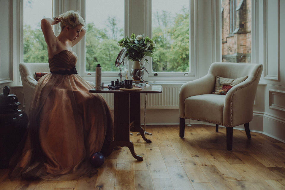 Victoria wore an alternative ballgown style dress by Aftershock for her intimate, outdoor, rainy day wedding in Scotland. Images by Drawing Room Photography.