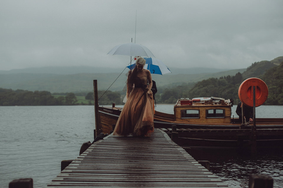 Victoria wore an alternative ballgown style dress by Aftershock for her intimate, outdoor, rainy day wedding in Scotland. Images by Drawing Room Photography.