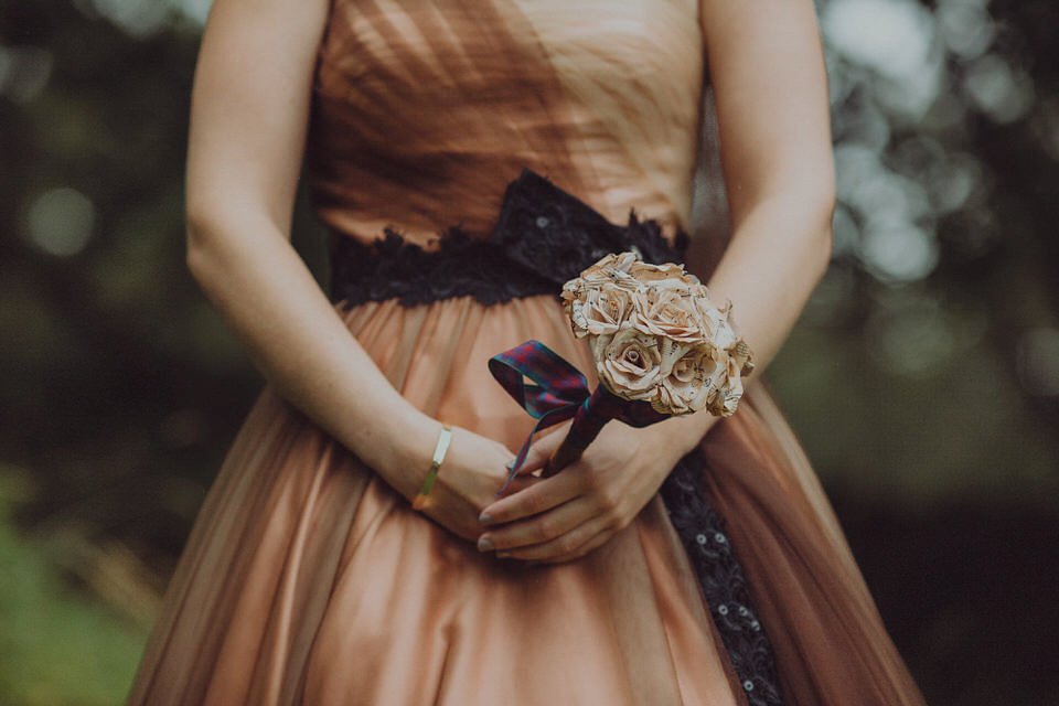 Victoria wore an alternative ballgown style dress by Aftershock for her intimate, outdoor, rainy day wedding in Scotland. Images by Drawing Room Photography.