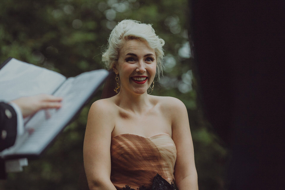 Victoria wore an alternative ballgown style dress by Aftershock for her intimate, outdoor, rainy day wedding in Scotland. Images by Drawing Room Photography.