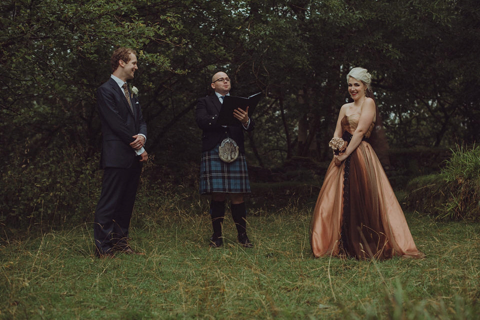 Victoria wore an alternative ballgown style dress by Aftershock for her intimate, outdoor, rainy day wedding in Scotland. Images by Drawing Room Photography.