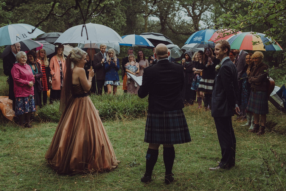 Victoria wore an alternative ballgown style dress by Aftershock for her intimate, outdoor, rainy day wedding in Scotland. Images by Drawing Room Photography.