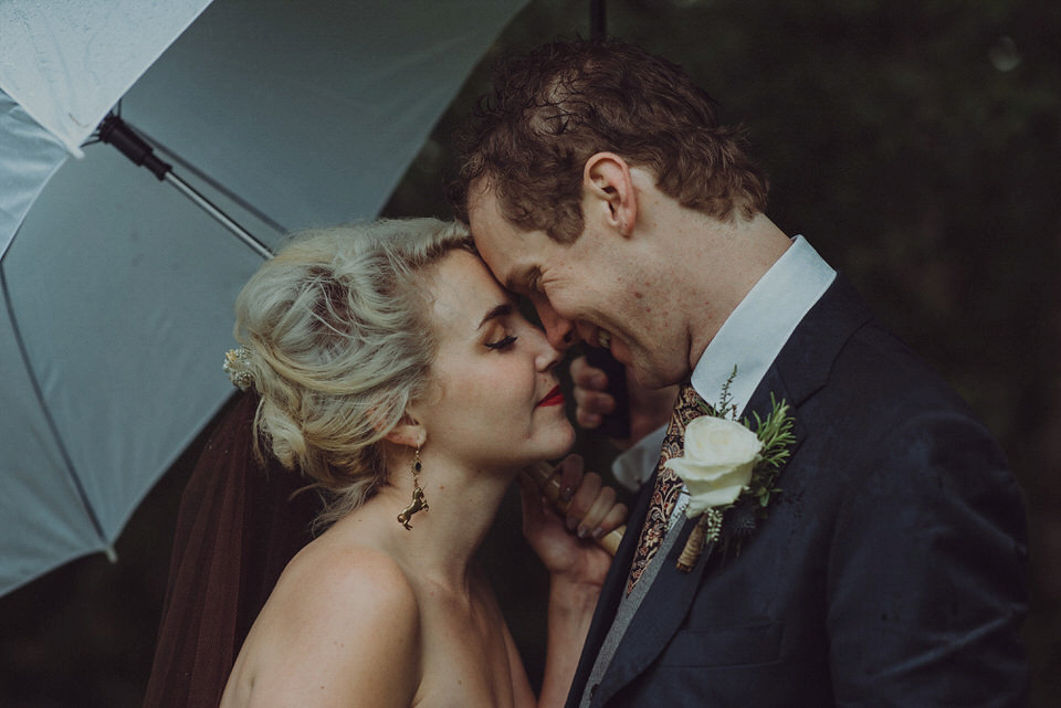 Victoria wore an alternative ballgown style dress by Aftershock for her intimate, outdoor, rainy day wedding in Scotland. Images by Drawing Room Photography.