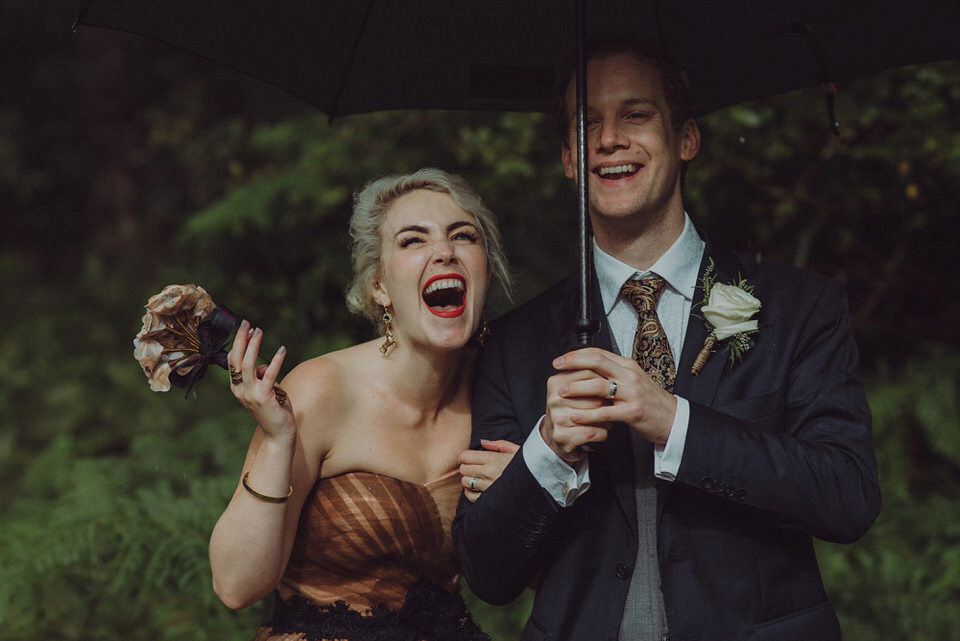 Victoria wore an alternative ballgown style dress by Aftershock for her intimate, outdoor, rainy day wedding in Scotland. Images by Drawing Room Photography.