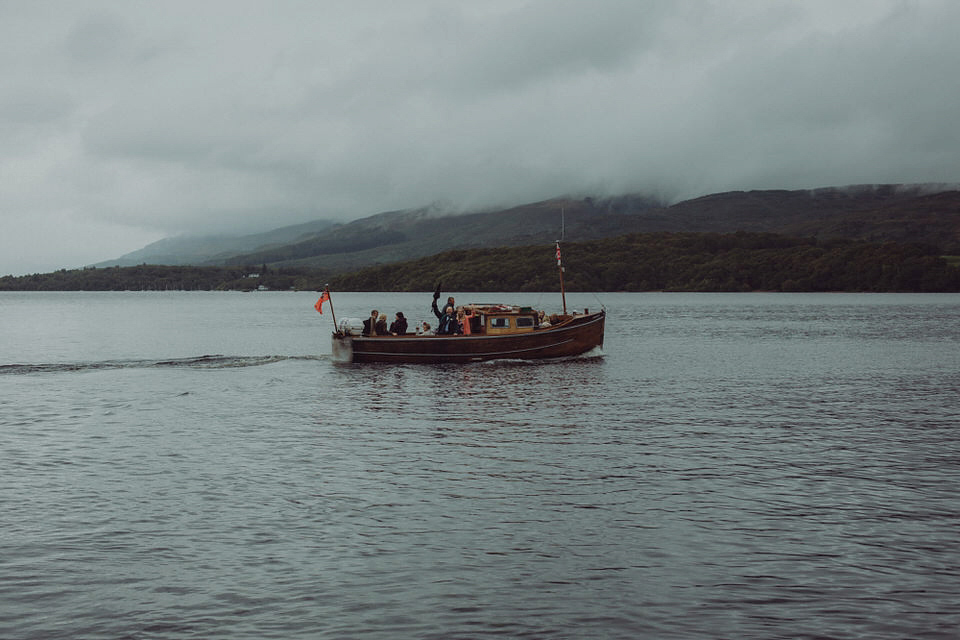 Victoria wore an alternative ballgown style dress by Aftershock for her intimate, outdoor, rainy day wedding in Scotland. Images by Drawing Room Photography.