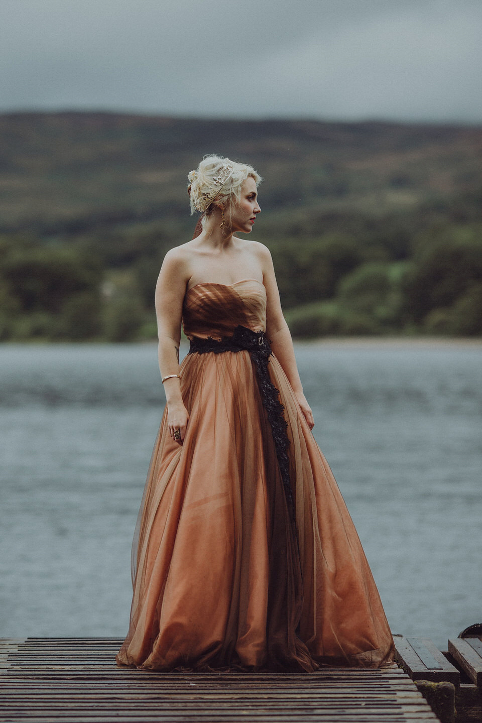 Victoria wore an alternative ballgown style dress by Aftershock for her intimate, outdoor, rainy day wedding in Scotland. Images by Drawing Room Photography.