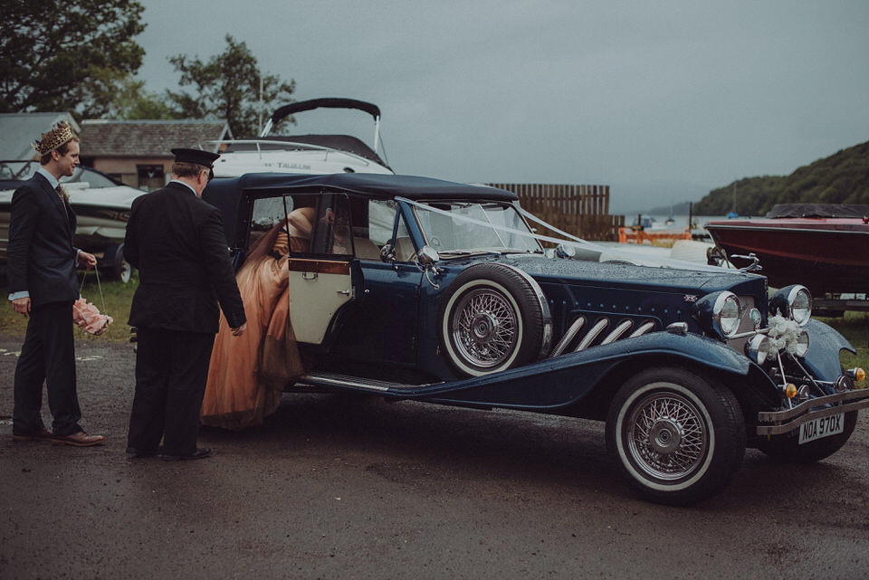 Victoria wore an alternative ballgown style dress by Aftershock for her intimate, outdoor, rainy day wedding in Scotland. Images by Drawing Room Photography.