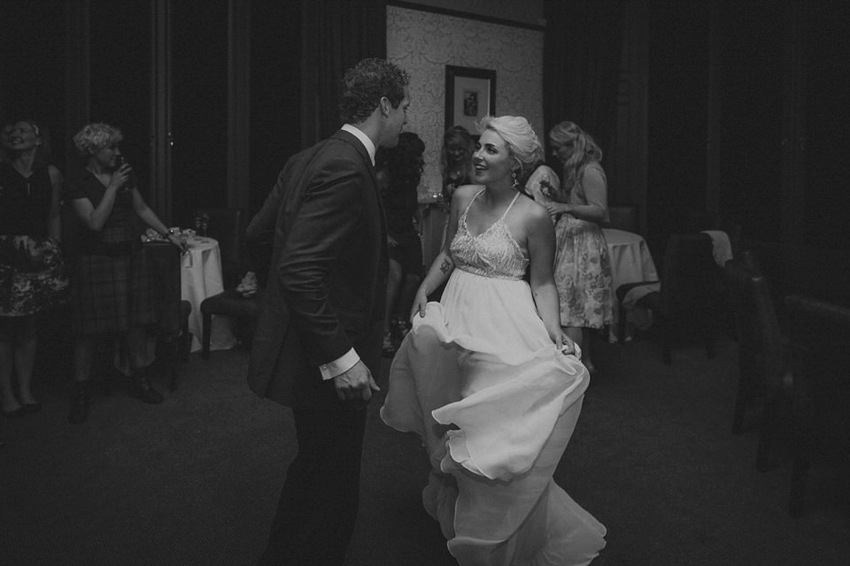 Victoria wore an alternative ballgown style dress by Aftershock for her intimate, outdoor, rainy day wedding in Scotland. Images by Drawing Room Photography.