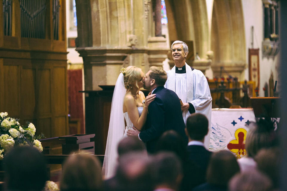 Lou wore a Kobus Dippenaar gown for her glamorous Tudor Manor house wedding. Photography by Joseph Hall.