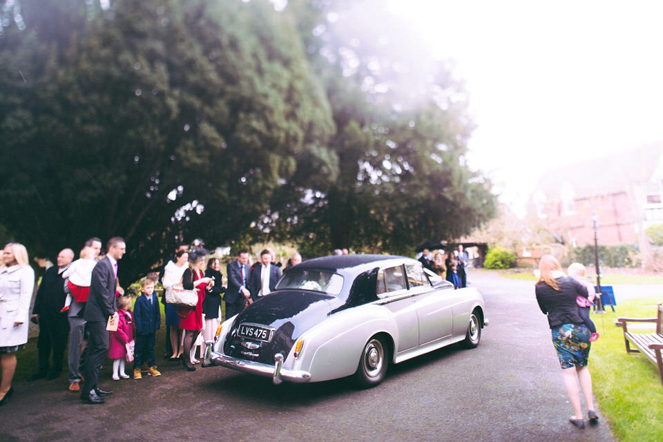 Lou wore a Kobus Dippenaar gown for her glamorous Tudor Manor house wedding. Photography by Joseph Hall.