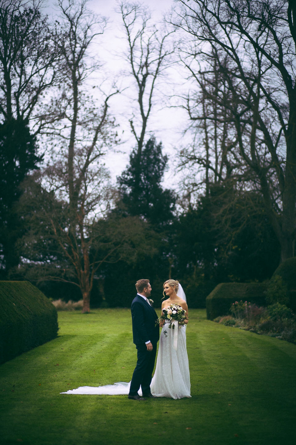 Lou wore a Kobus Dippenaar gown for her glamorous Tudor Manor house wedding. Photography by Joseph Hall.