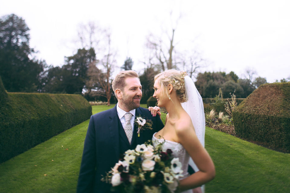 Lou wore a Kobus Dippenaar gown for her glamorous Tudor Manor house wedding. Photography by Joseph Hall.