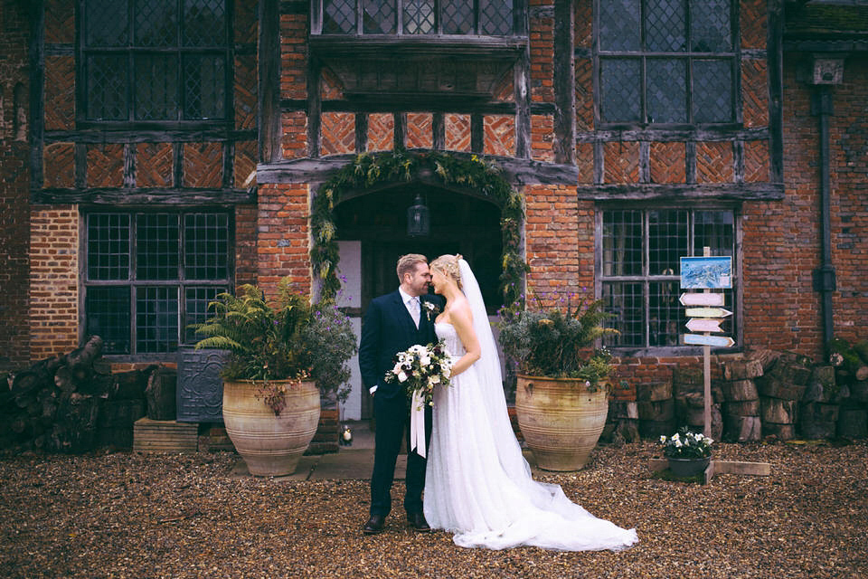 Lou wore a Kobus Dippenaar gown for her glamorous Tudor Manor house wedding. Photography by Joseph Hall.