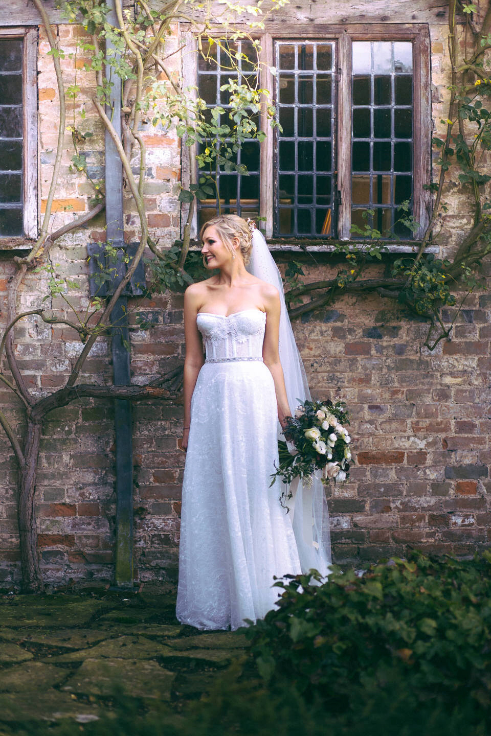 Lou wore a Kobus Dippenaar gown for her glamorous Tudor Manor house wedding. Photography by Joseph Hall.