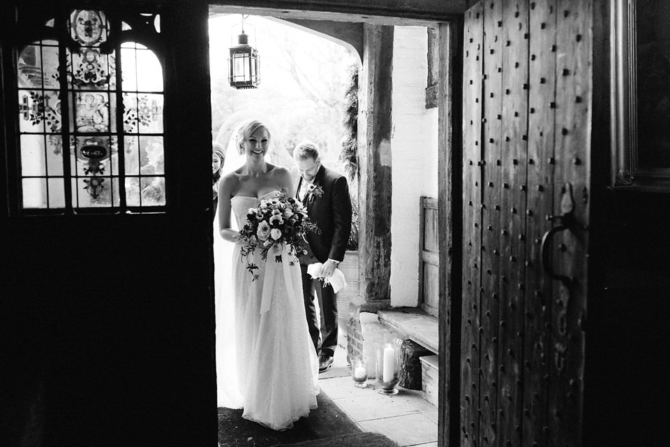 Lou wore a Kobus Dippenaar gown for her glamorous Tudor Manor house wedding. Photography by Joseph Hall.