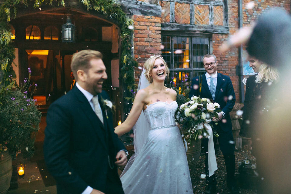 Lou wore a Kobus Dippenaar gown for her glamorous Tudor Manor house wedding. Photography by Joseph Hall.