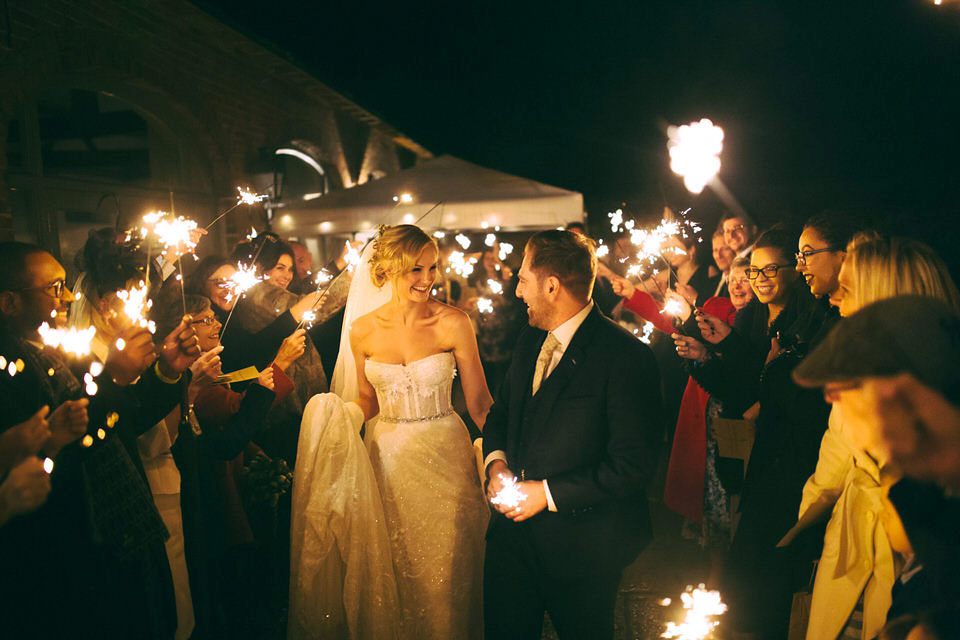 Lou wore a Kobus Dippenaar gown for her glamorous Tudor Manor house wedding. Photography by Joseph Hall.