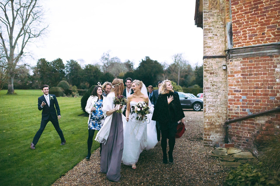 Lou wore a Kobus Dippenaar gown for her glamorous Tudor Manor house wedding. Photography by Joseph Hall.