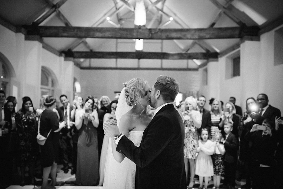 Lou wore a Kobus Dippenaar gown for her glamorous Tudor Manor house wedding. Photography by Joseph Hall.