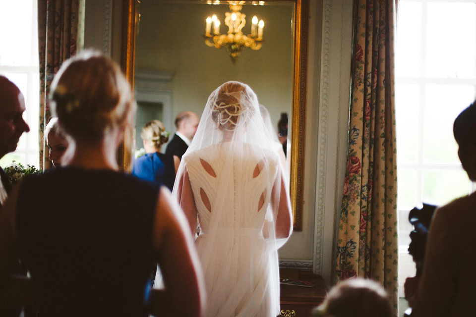 A cut-out dress made by the bride for her modern monochrome and Art Deco inspired wedding. Photography by Naomi Fowler.