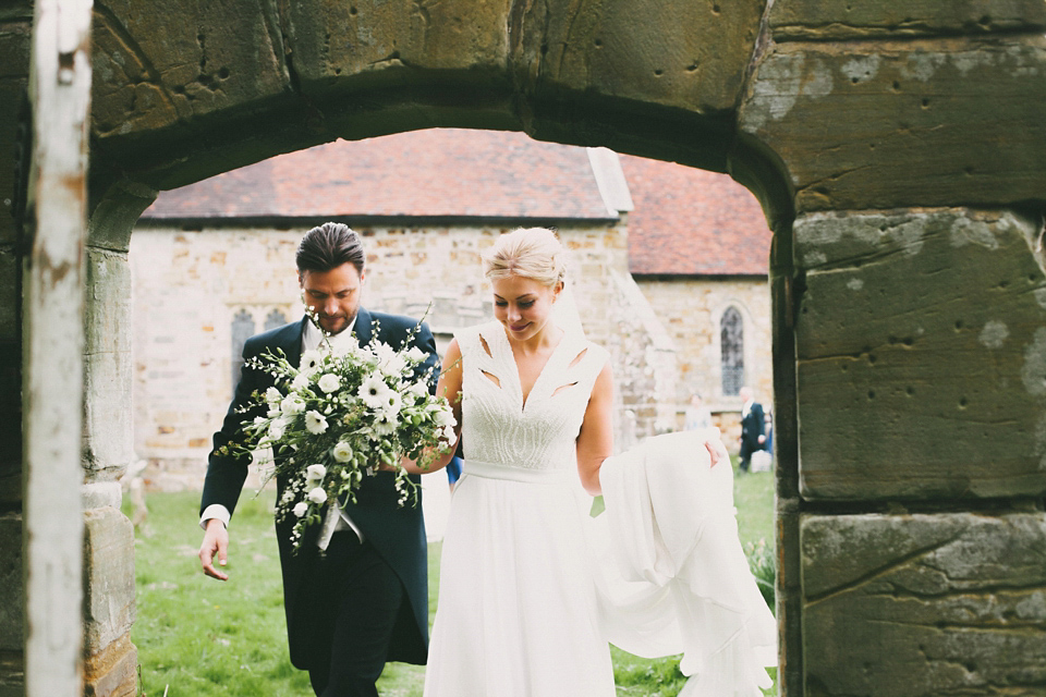 A cut-out dress made by the bride for her modern monochrome and Art Deco inspired wedding. Photography by Naomi Fowler.