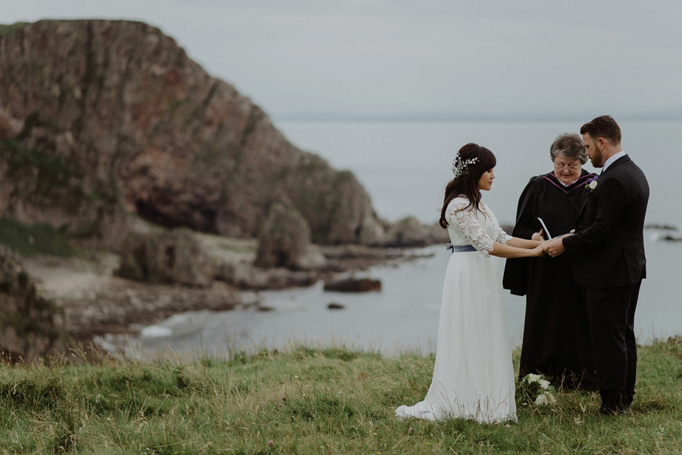 An heirloom wedding dress for an atmospheric and intimate elopement on the Isle of Islay. Photography by The Kitcheners.